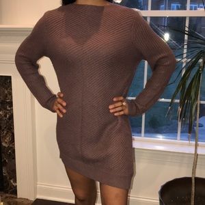Sweater dress. Can be belted worn with boots